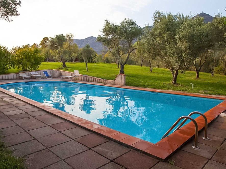 Outdoor swimming pool at sunset